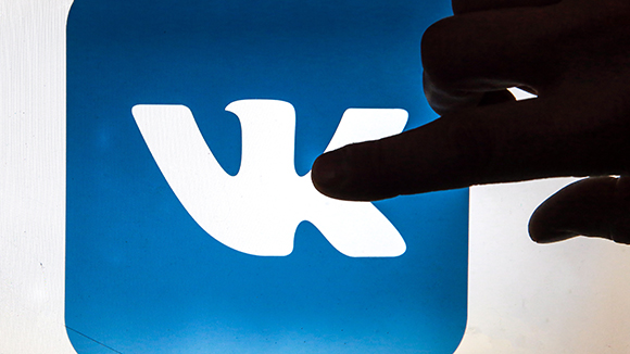 ST PETERSBURG, RUSSIA - NOVEMBER 21, 2016: A hand touching or pointing to the logo of the VK (Vkontakte) social network on a computer screen. Sergei Konkov/TASS –осси€. —анкт-ѕетербург. ѕриложение социальной сети 